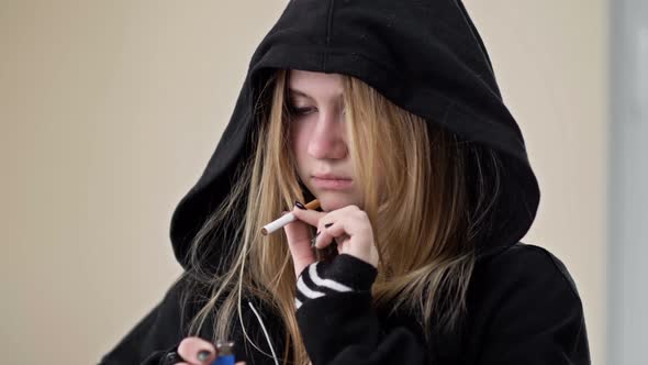 A Teenage Girl is About to Smoke but Something Stops Her