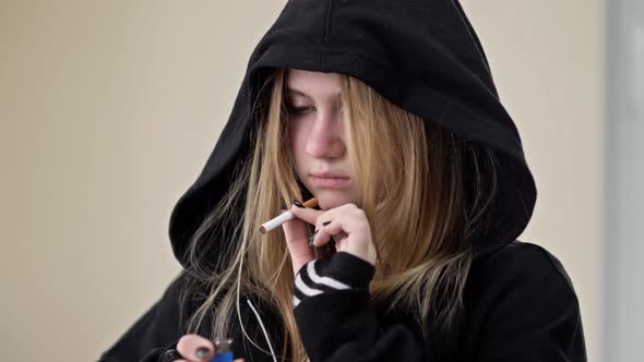 A Teenage Girl is About to Smoke but Something Stops Her alt