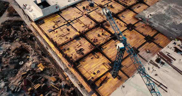 Flight Over the Construction Plant of the Shopping Center with Crane and Scaffolding