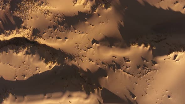 Aerial view of sand dune textures and shadows in the arid region of the Northern Cape, South Africa alt
