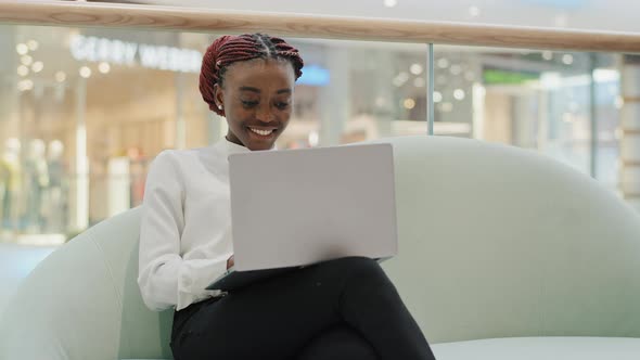 Happy Smiling Girl African American Student Business Woman Freelancer Sitting on Sofa in Office alt