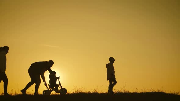 Silhouettes Family Is Together at Sunset by SergGrbanoff | VideoHive