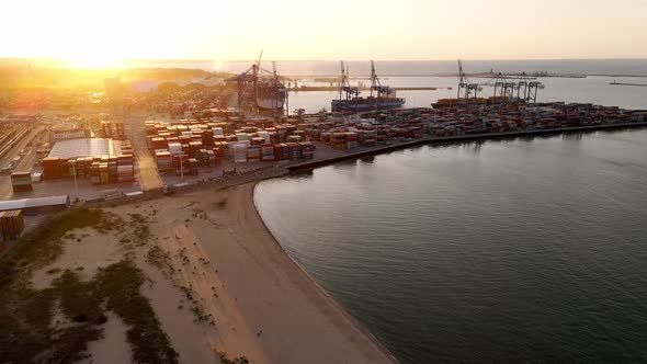 Aerial View of an Industrial Port with Cargo Containers at Sunset