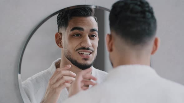 Funny Arabian Indian Bearded Man Speaking to Reflection Looking in Bathroom Mirror alt