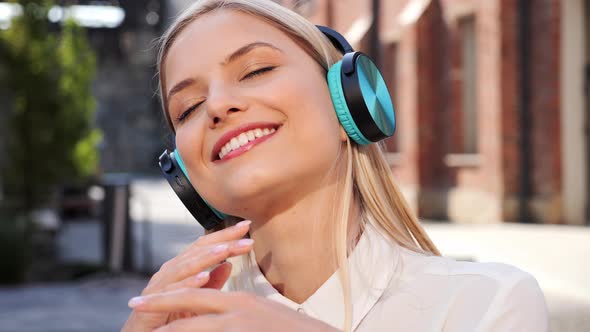 Smiling Young Girl Listening Music Outdoors Dancing Using Mobile Phone App alt