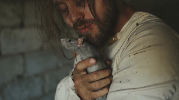 Crazy Terrible Maniac In Basement With Window Playing With Rat alt