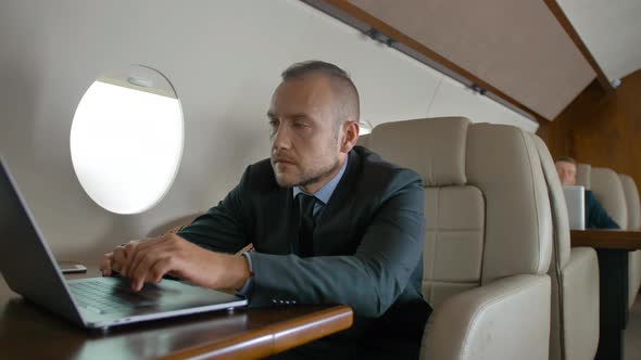 Entrepreneur Traveling on His Private Jet alt