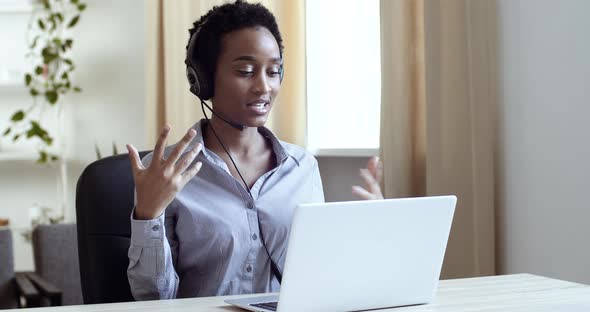 Successful Afro American Girl Business Woman Manager Operator Assistant Wears Head Microphone alt