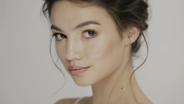 Cute Girl with Nice Make up Looking To Camera and Smiling alt