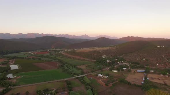 Aerial travel drone view of farms and farming. alt
