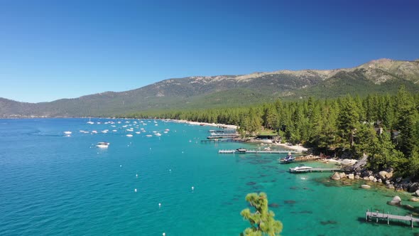 Aerial View Of Boats Near Shore Of Lake Tahoe, California, USA - drone shot alt