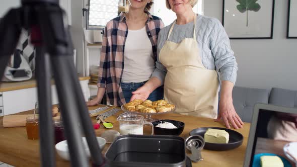 Tilt up video of two women vlogger creating social media. Shot with RED helium camera in 8K. alt