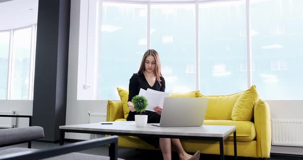Concerned Woman Working and Thinking Solving Problem at Office. Serious Attractive Female Working alt