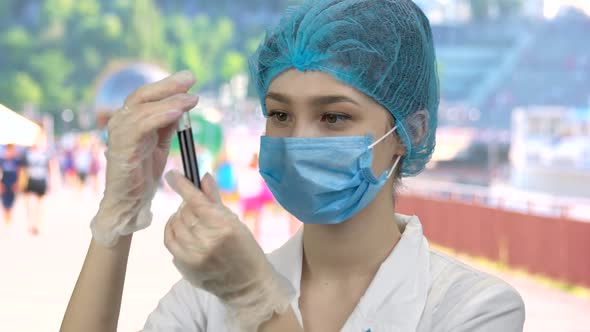 Portrait of Nurse Doctor with Blood Test Capsule alt