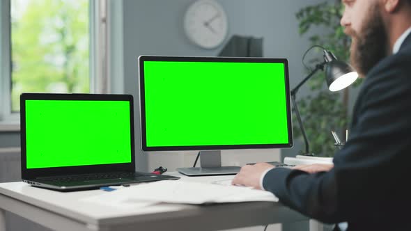 Man with Two Chroma Key Computers