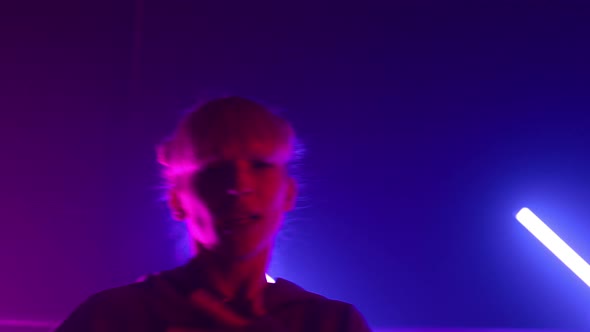 Woman Making Hiphop Hands Movements in Nightclub Close Up alt