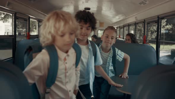 Diverse School Teens Getting Out Schoolbus alt