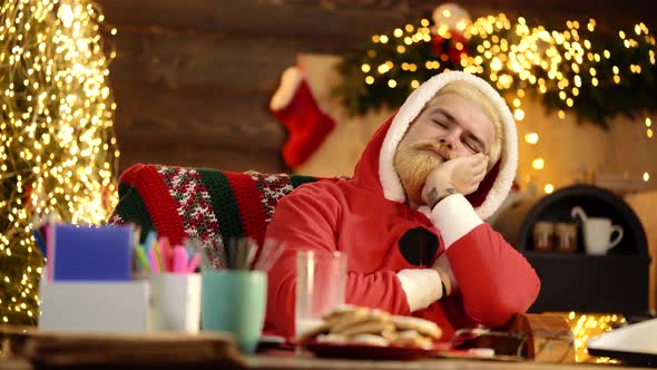 Funny Sleeping Santa, Santa Claus Relaxing After or Before Work in Christmas Room alt
