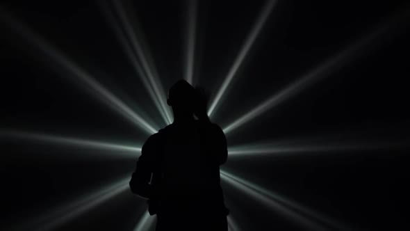 Young Couple Dancing Latin Music. Bachata, Merengue, Salsa. Shot in a Dark Studio with Neon Lights alt