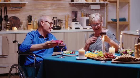 Holding a Gift From Her Man alt