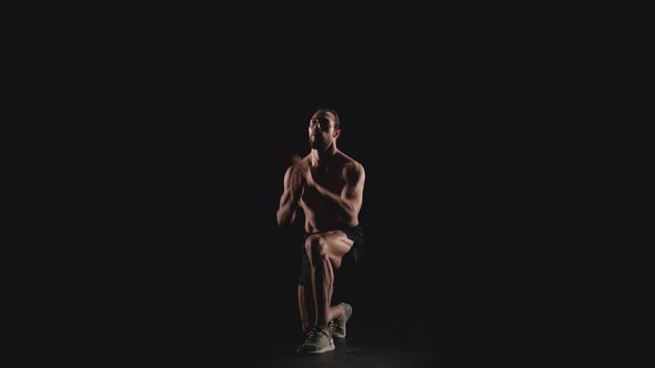 Athletic Man Does Physical Exercises alt