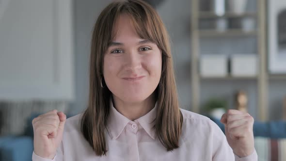 Young Girl Celebrating Success alt