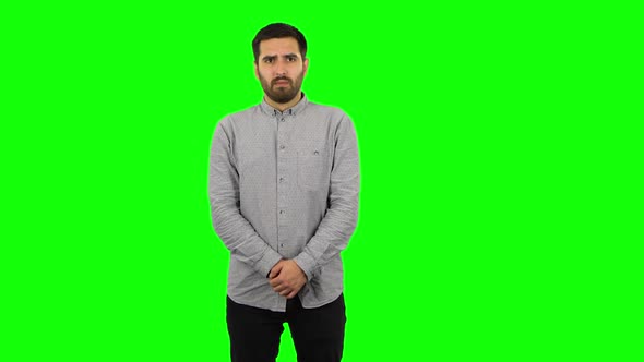 Brunette Guy in Anticipation of Worries, Then Guilty Hides His Eyes. Green Screen alt