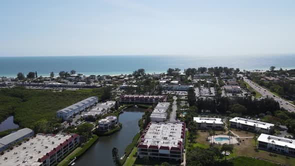 Aerial flying to Holmes Beach on Anna Maria Island in Manatee County, Florida alt