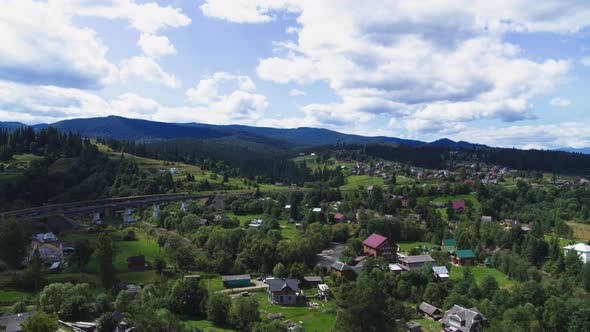 The Viaduct in Vorokhta is a Railway Stone Arch Bridge Across the Prut River Aerial View alt