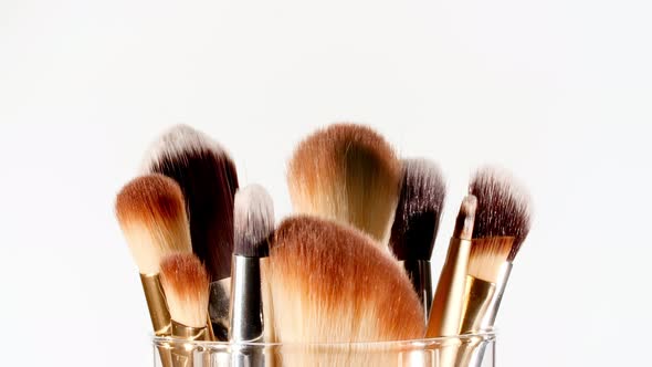 Makeup Brushes Rotation on White Background alt