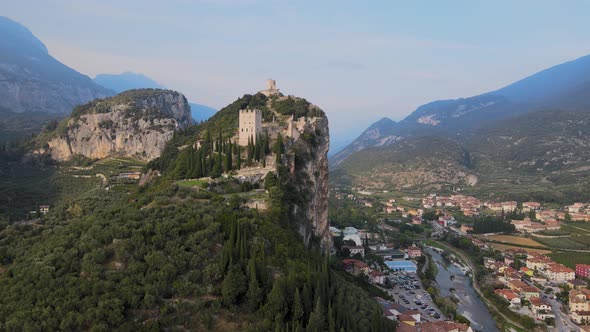 Castello di Arco, castle on steep cliff above Reva Del Garda city Trentino Italy . Aerial view of la alt