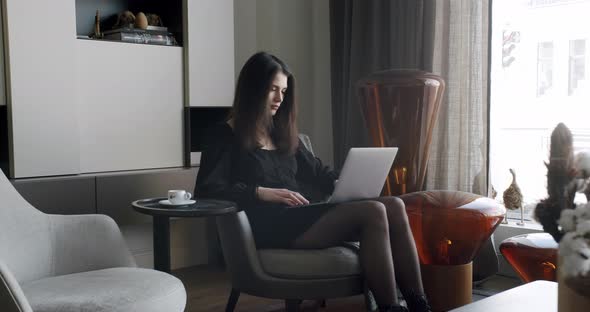 Young Adult Business Woman Typing on Laptop Computer Working in Internet alt