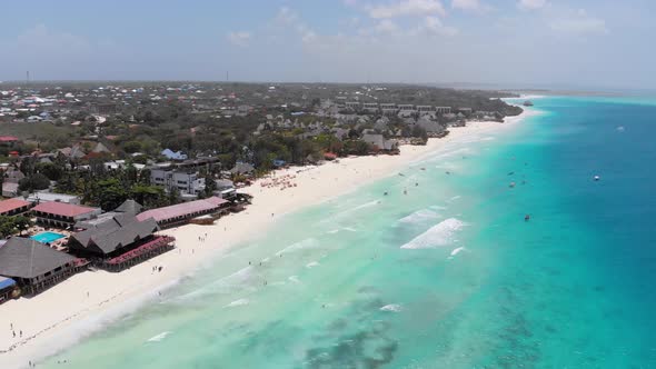 Aerial Coastline of Paradise Beach and Clear Water Over Reef in Ocean Zanzibar alt