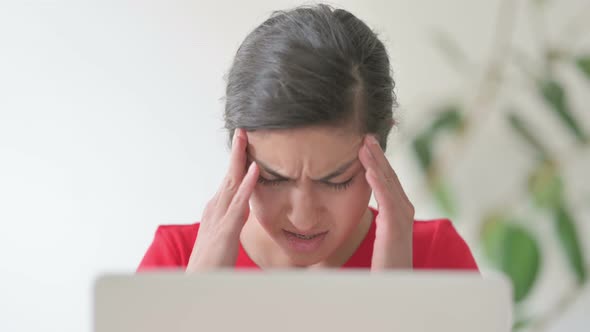 Close Up of Indian Woman Having Headache While Working on Laptop alt