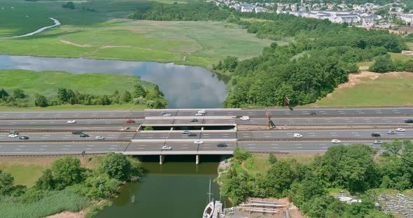 Aerial view highway in many car rushing along a high-speed on freeway alt