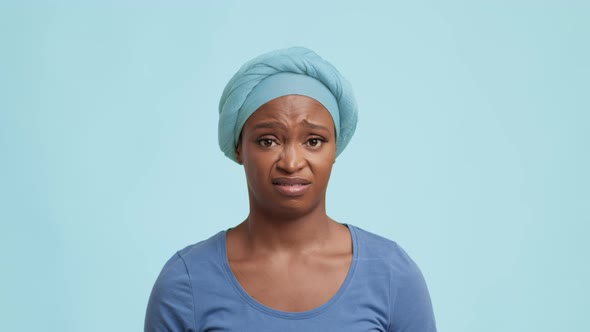 Frustrated African Female Shrugging Shoulders Shaking Head Over Blue Background alt