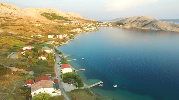 Flying above vacation houses on the island of Pag alt