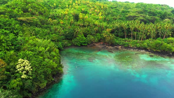 Aerial: flying over tropical island Banda Islands Maluku Indonesia Maldives Poly alt