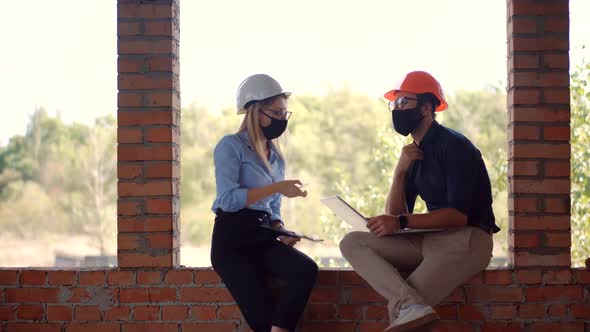 Engineer Architect  In Face Mask Cooperating Working, Engineer In Hard Hat Developing In Lockdown alt