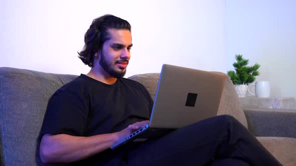 Frustrated Indian man working from late at night alt