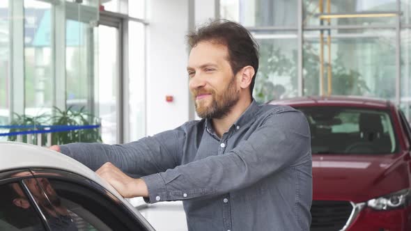 Mature Happy Handsome Man Posing with His New Automobile alt