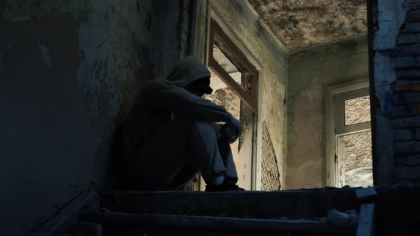 The Guy Is Crying. Lonely Person In An Abandoned House In Sadness Or Depression. alt