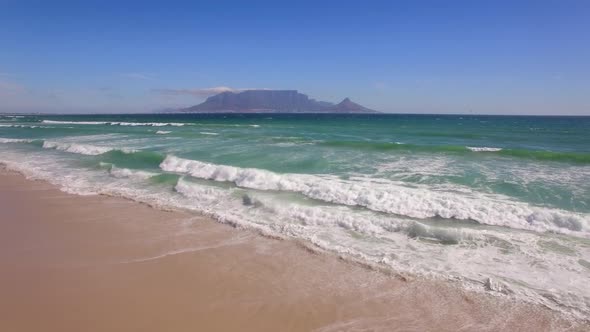 Aerial travel drone view of Table Mountain, Table Bay from Bloubergstrand, Cape Town, South Africa. alt