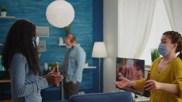 Happy Multiracial Friends with Protective Mask Touching Elbow alt