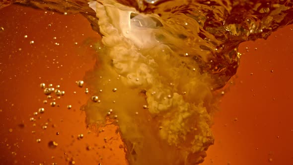 Super Slow Motion Shot of Pouring Cream Into Coffee Whirl at 1000Fps alt