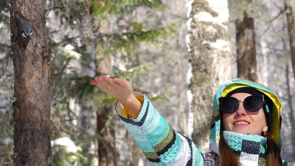 Bird in Women's Hand Eat Seeds alt
