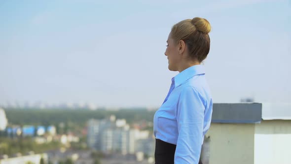 Cheerful Female Manager Enjoying Cityscape Standing Office Terrace, Work Break