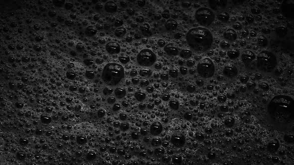 Black Foam With Bubbles Popping alt