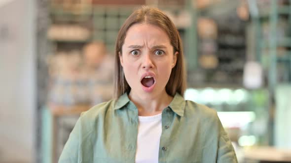 Portrait of Upset Young Woman Feeling Shocked  alt