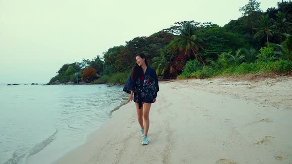 Cute Smiling Asian Girl in Kimono Walking on a Beach in Slow Motion Thailand
